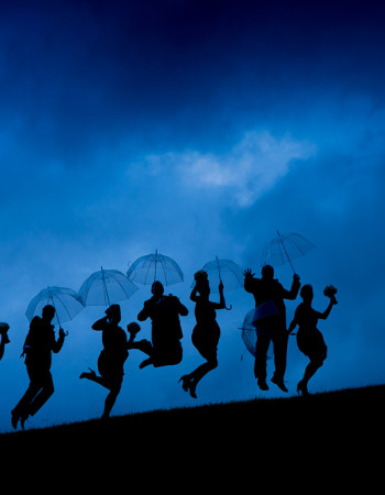 stormy sky sillouette of bridal party group for wedding photography