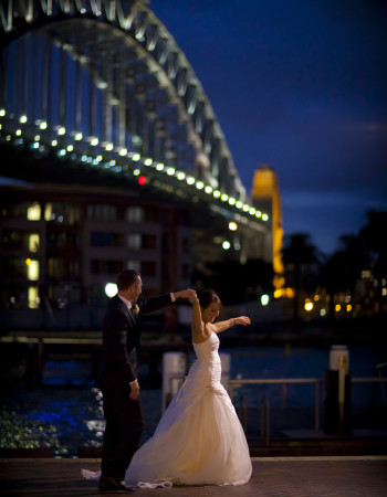 Wedding Photography night image of couple under harbour bridge