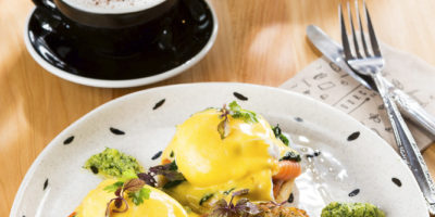 Cafe food photography image of poached eggs with hollandaise sauce