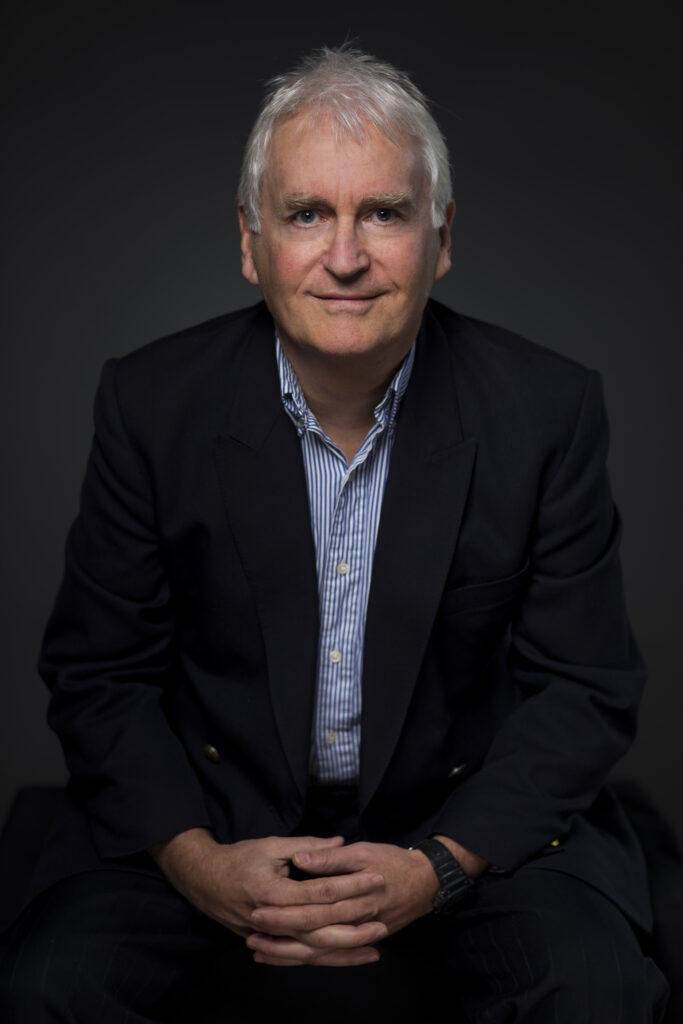 headshots example of male on dark background shot in the studio in Auckland, New Zealand. Captured by professional photographer Adam Firth.