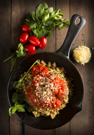 Vibrant tomato and quinoa dish photographed for a cook book