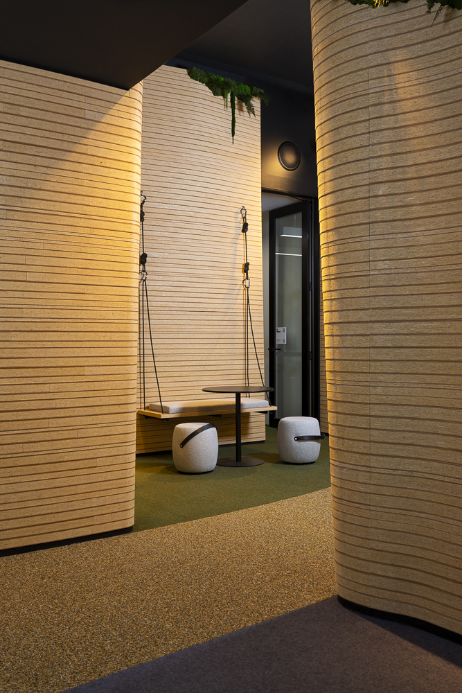 Canyon like walls of the corridors lead to a meeting nook, in the Google Auckland offices