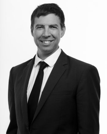 black and white headshot captured in Auckland CBD