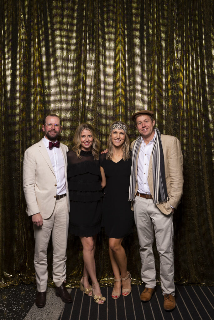 two couples photographed at primary school fundraiser evening