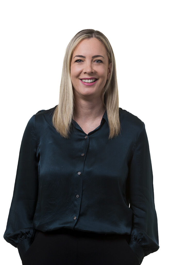 Studio style headshot image of professional female office company staff member