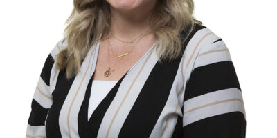 Corporate headshot against a white background captured in Auckland
