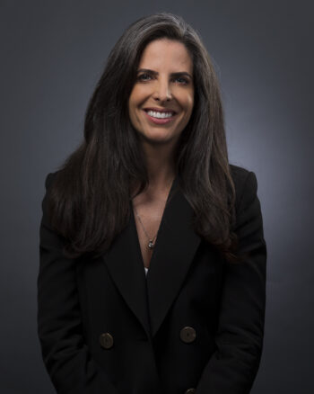 Studio headshot on a grey background of a lawyer captured in Kingsland, Auckland by Adam Firth Photography