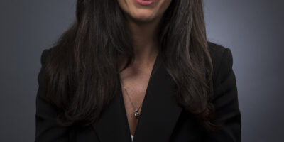Studio headshot on a grey background of a lawyer captured in Kingsland, Auckland by Adam Firth Photography