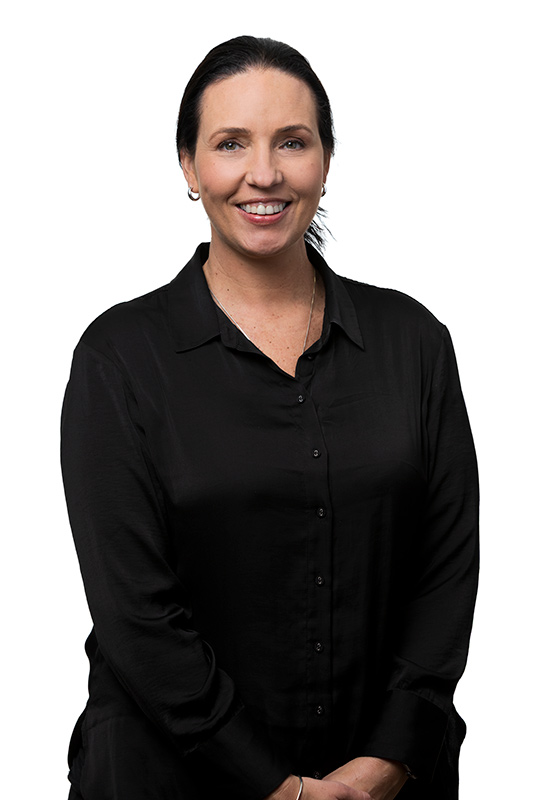 Middle aged female office worker photographed in front of a white background wearing a black top for her headshot. Photographed by Adam Firth a professional headshot photographer based in Auckland New Zealand