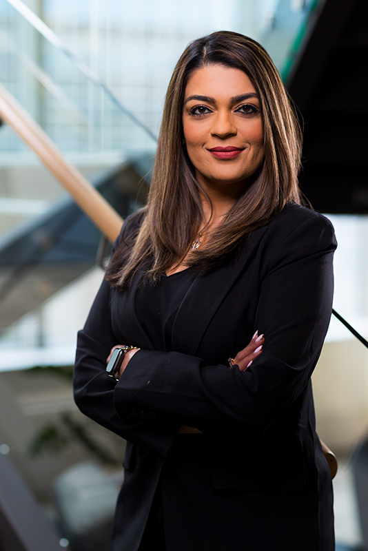 Headshot image of lady captured in stair area of Auckland offices of NIB by Professional headshot photographer Adam Firth
